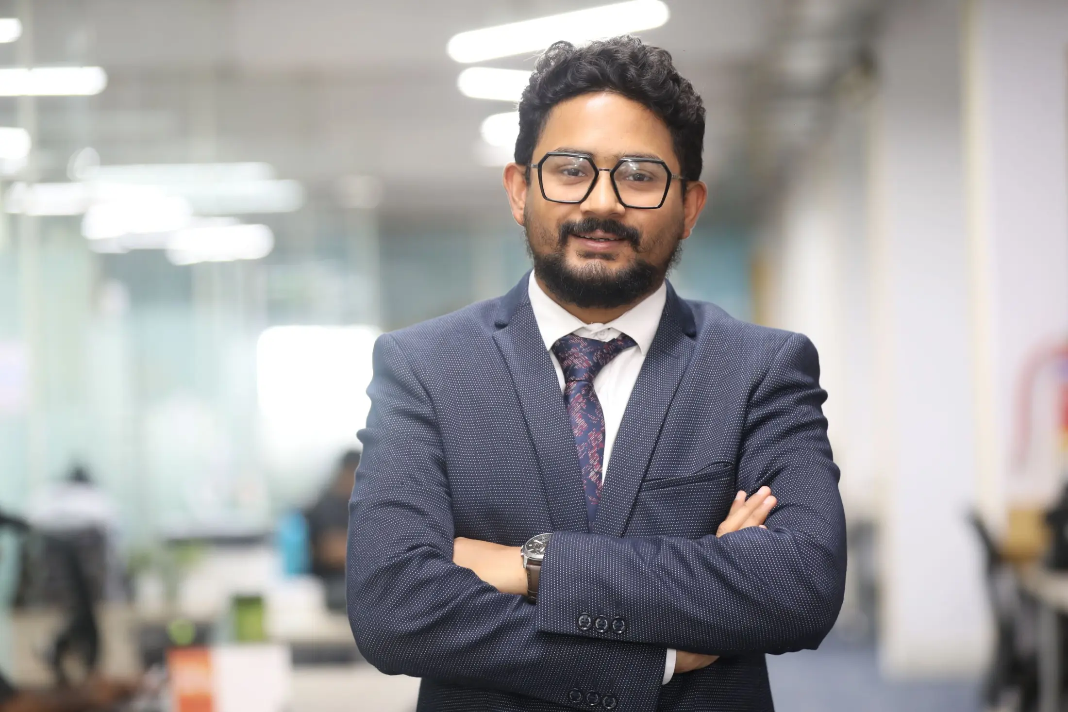 Indian business professional in a modern Bangalore office