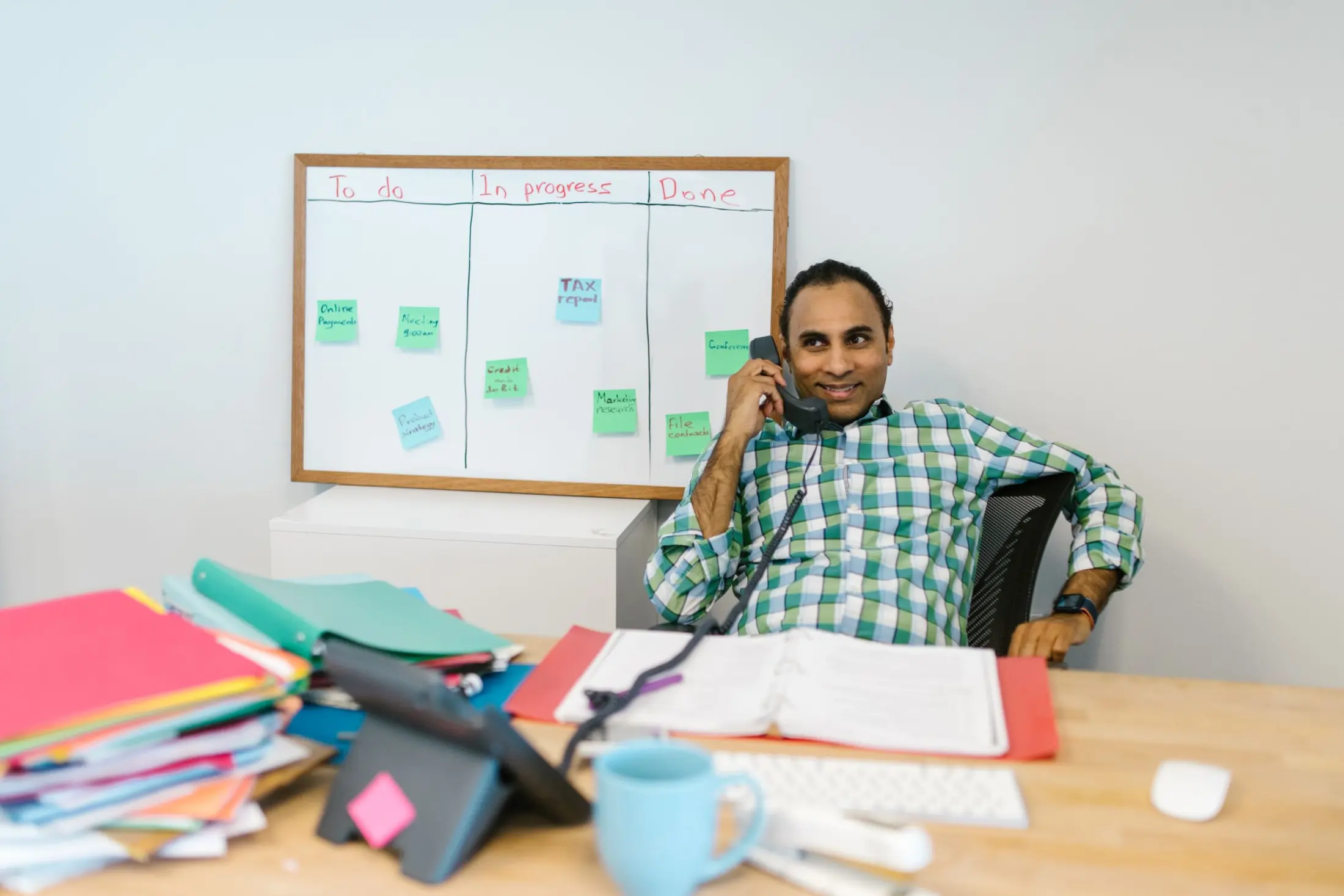 Indian professional planning work in a modern office