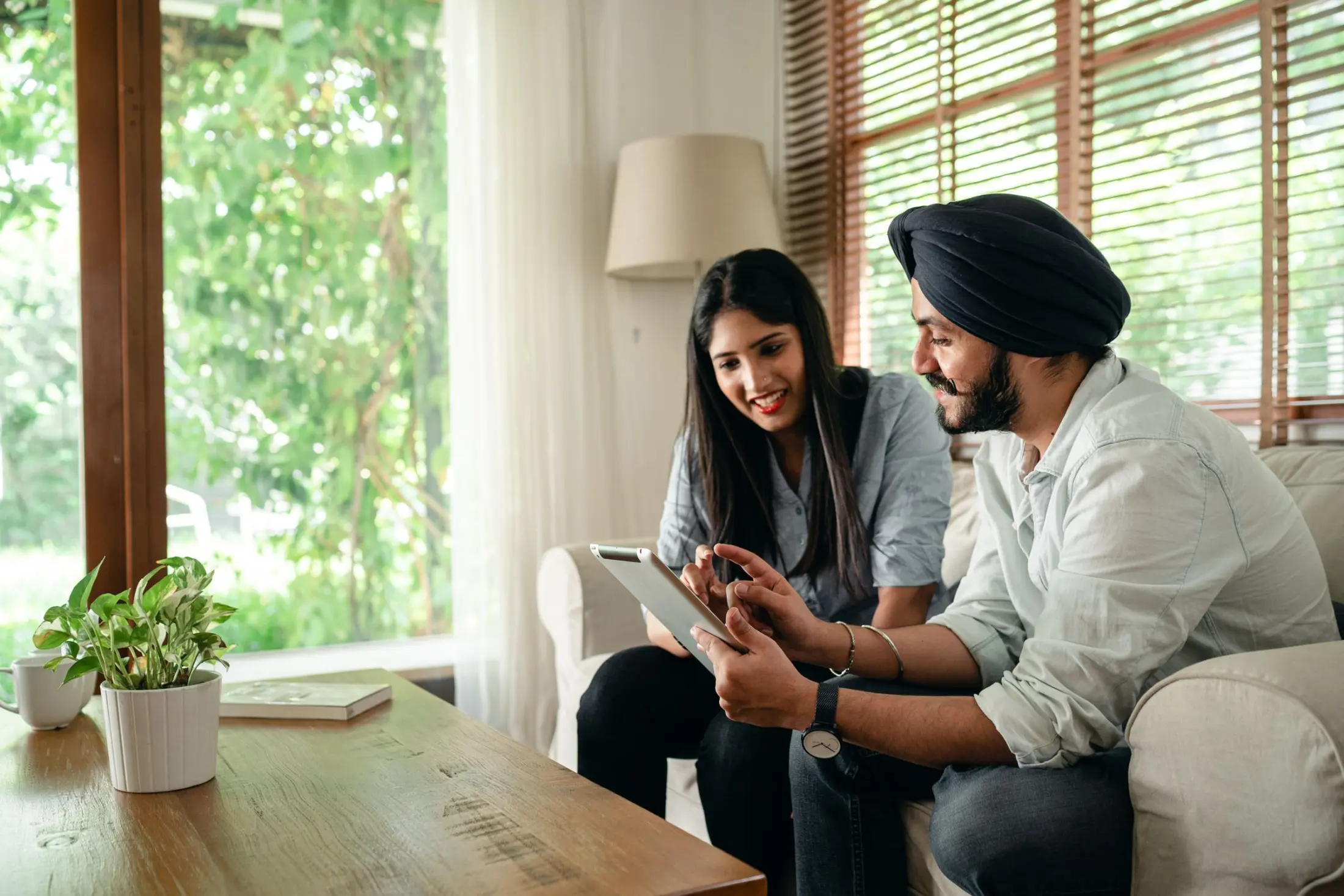Indian colleagues reviewing work together on a tablet
