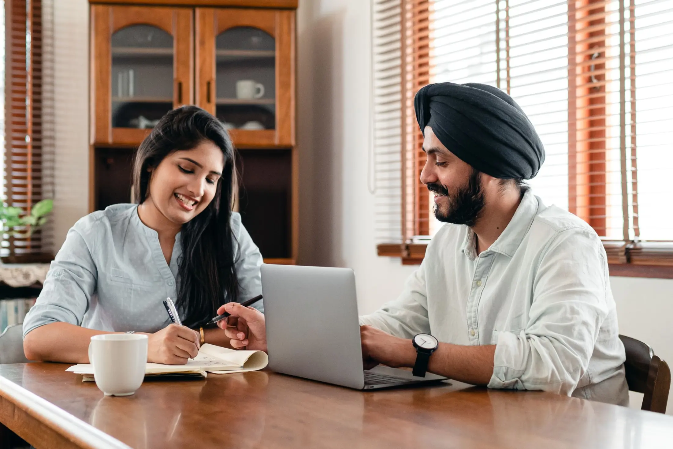 Indian strategy team collaborating on a laptop in an office