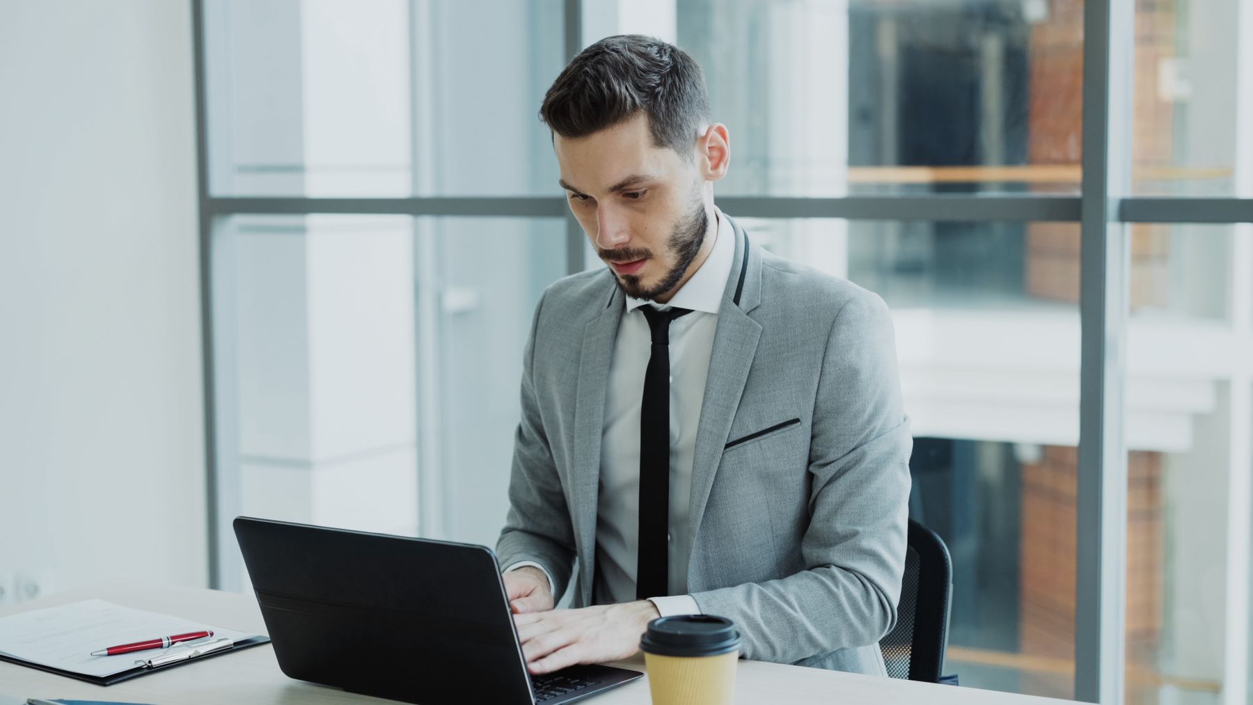 Young Indian businessman working in a modern office